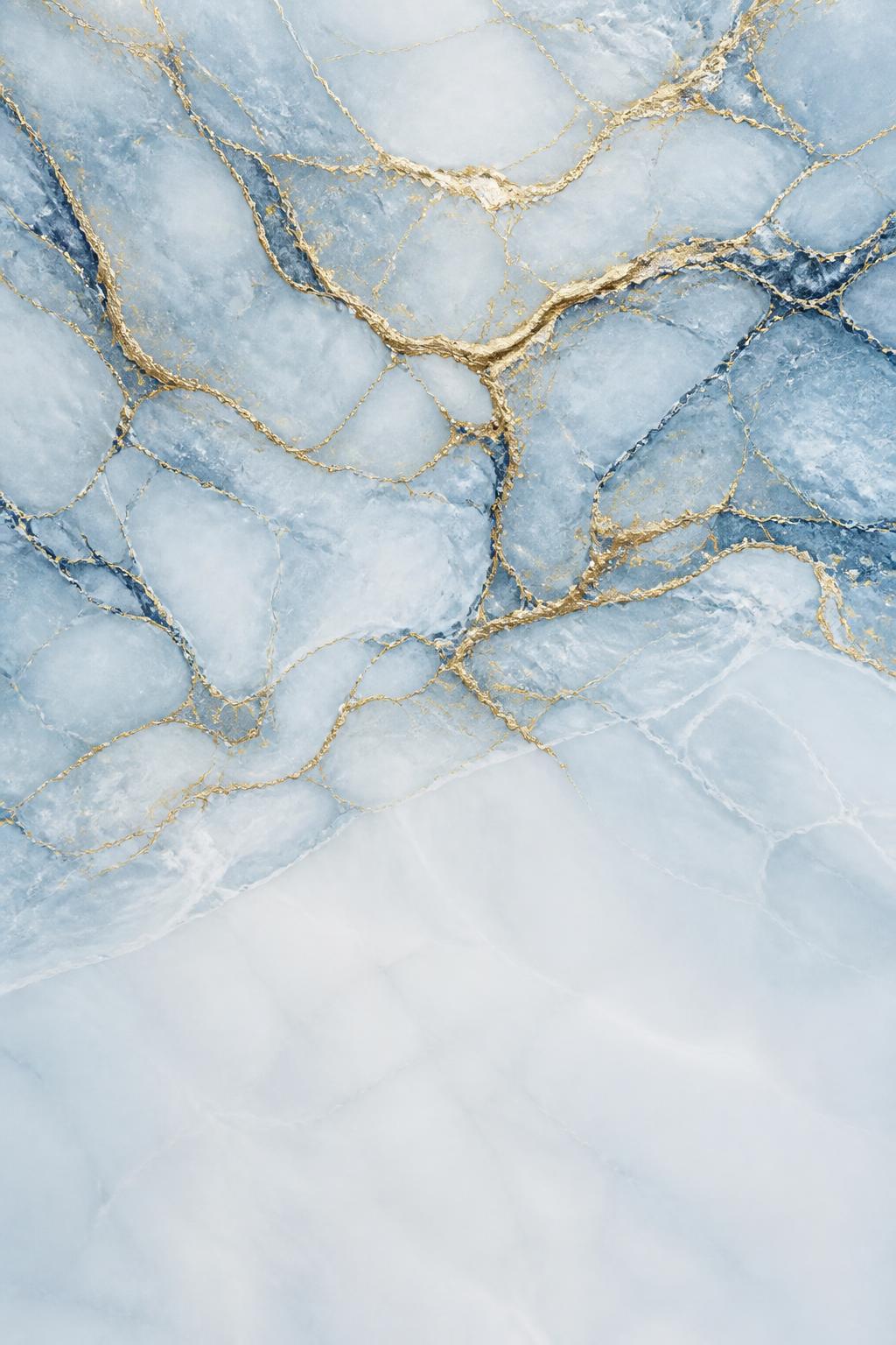 Pale ice-blue marble with flowing gold veins and blue-grey mineral veining